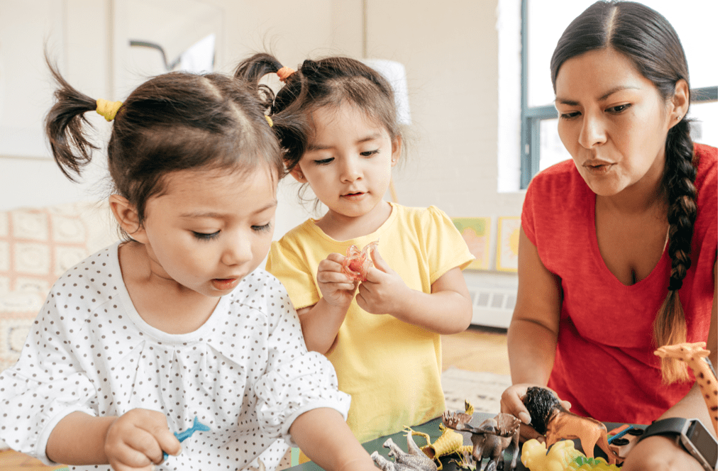 Mother playing with young daughters