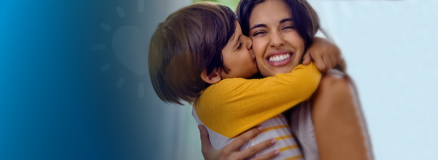 Mother and son embracing 