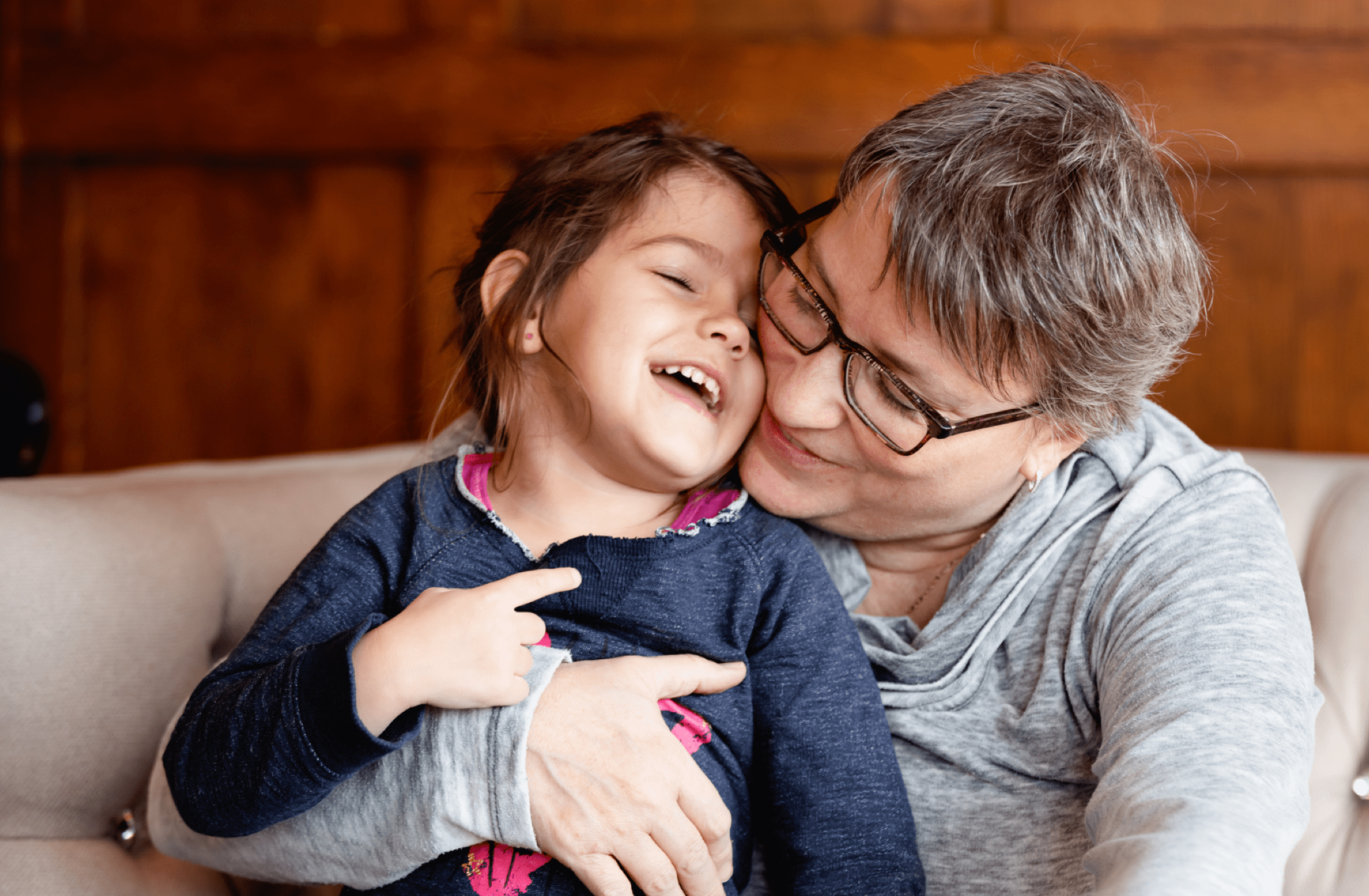 Grandmother at coffee shop with her granddaughter