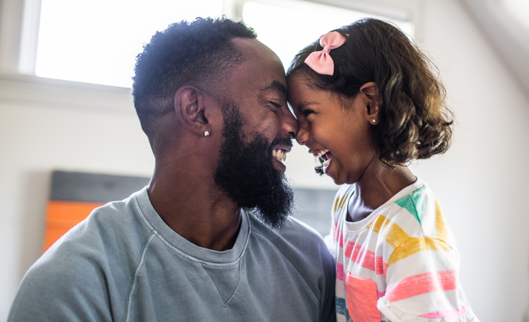 Father and daughter laughing