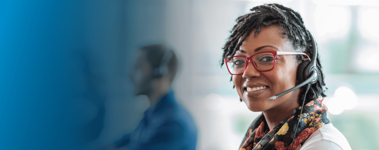 Customer service representative helping someone over the phone