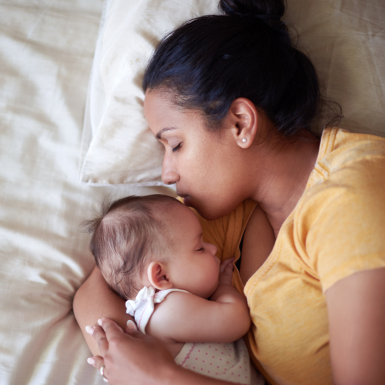 Woman holding a sleeping baby