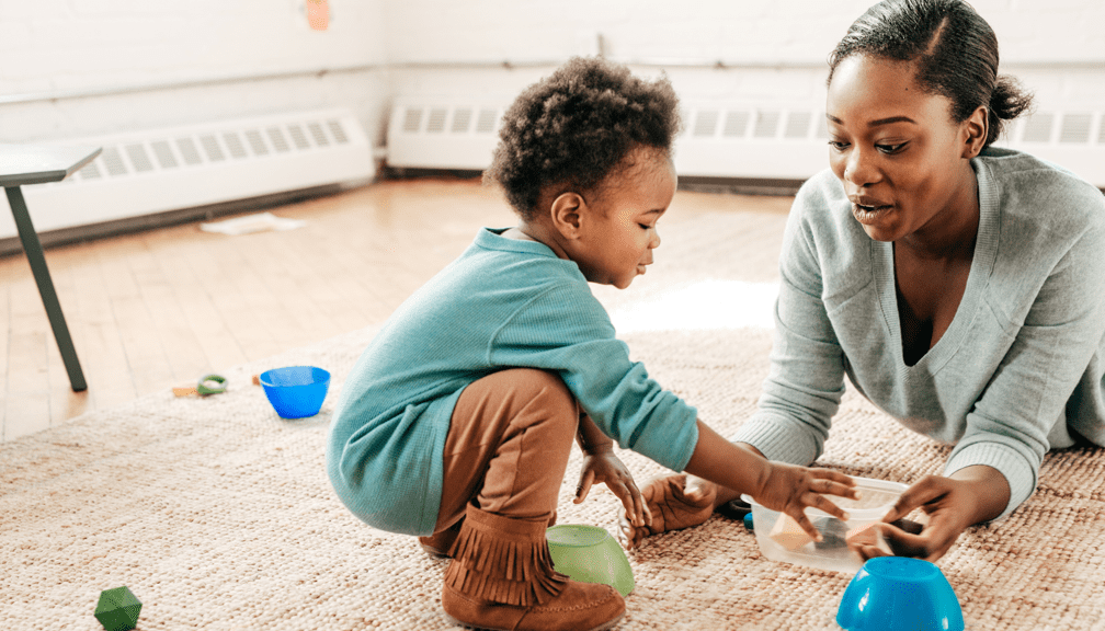 Mom and toddler playing on the floor