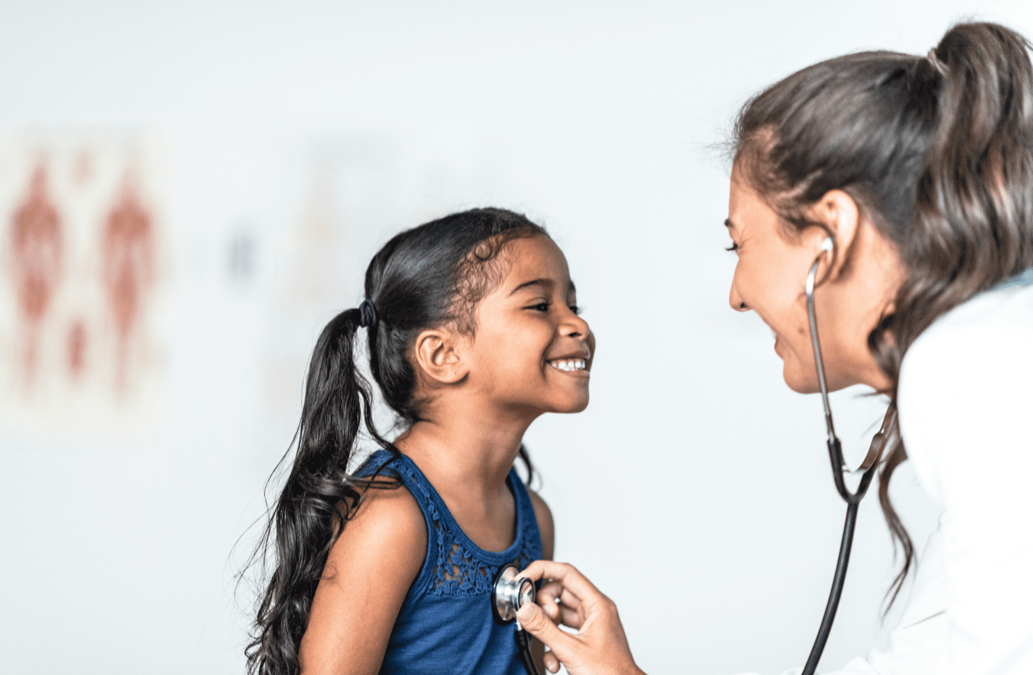 Young girl is examined by female doctor