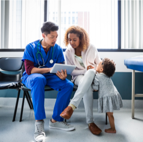 Doctor showing mother test results on a tablet.