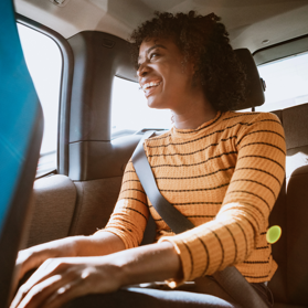 Woman sitting in the backseat of a car