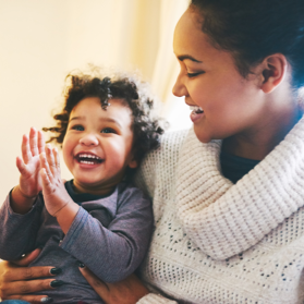 Mother and baby laughing